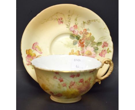 A Royal Worcester blush ivory cabinet cup and saucer