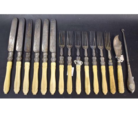 A set of  six fruit knives and forks, carved  hafts, mid 19th century;  a silver butter knife;  a silver hafted button hook
