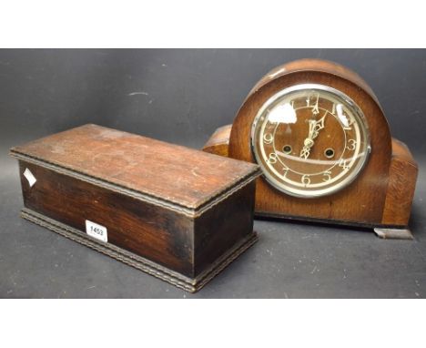 An oak cased mid 20th Century mantel clock with an oak lidded box