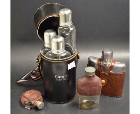 Three pewter and silver plated hip flasks, leather covered; leather Glenfiddich flask case containing three flasks 