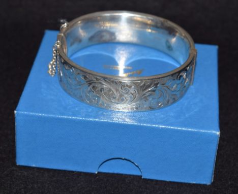 A silver hinged bangle, boxed