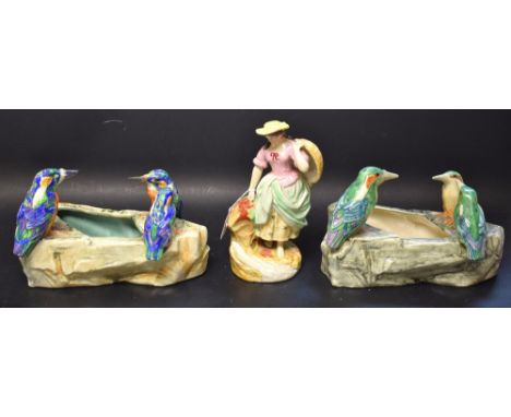 A Victorian Staffordshire figure, of a farm girl, c.1870; a late 19th century Majolica kingfisher trough; another similar (3)