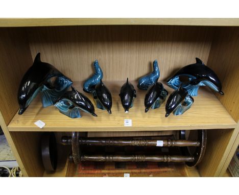 Poole Pottery dolphins and sealions.