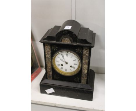 A Victorian black slate mantle clock.