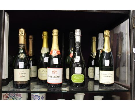 Twelve bottles of sparkling wine.