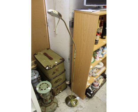 A floor standing reading lamp.