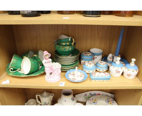 A shelf of decorative china.