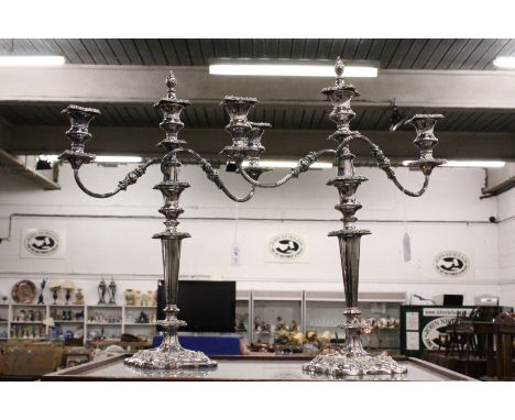 A good pair of plated three light candelabra.