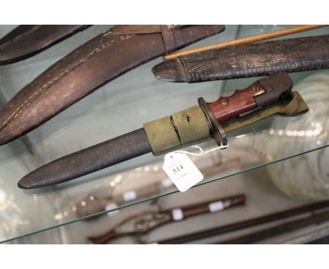 A British Army Land Service bayonet No. 7, Mark 1/L, with webbing frog.