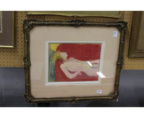 Reclining female nude in a classical decorative gilt frame. Colour print.