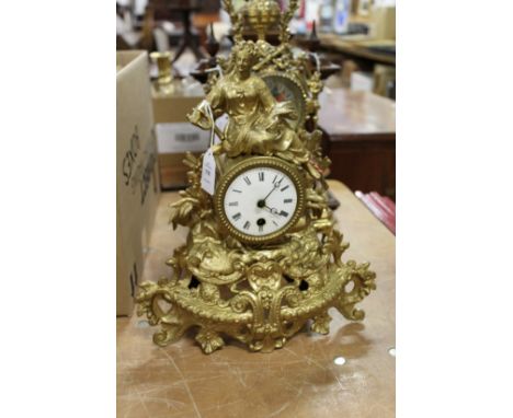 An ornate gilt spelter mantle clock.