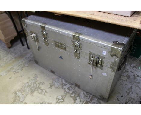 A large aluminium storage trunk.