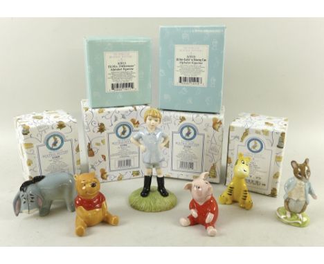 A collection of Winnie the Pooh figurines, comprising Doulton Christopher Robin, WP9, 13cm, a Beswick 'Pooh, 6cm, a Beswick '