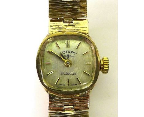 A 9ct gold lady's cocktail watch by Rotary, champagne face with gold baton numerals and hands, with bark textured 9ct gold st