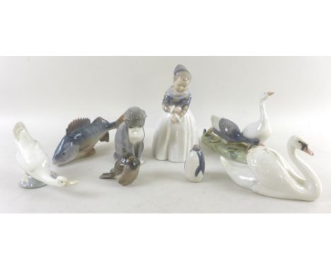 A collection of Royal Copenhagen figurines, comprising Girl in National Dress, model 1257, 19cm, a pair of geese, model 609, 