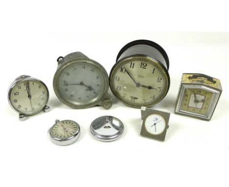 A group of seven vintage clocks, comprising a Smiths Synchronous Electric Clock with silvered dial in a bakelite case, circa 