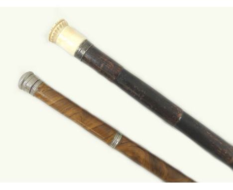 A pair of walking canes, one with white metal top and concealed vile within the shaft, 89cm, together with an Edwardian cane 