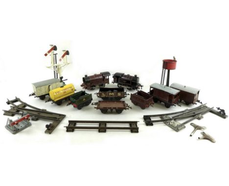 A group of Hornby O gauge locomotives, wagons, track and accessories, comprising a British Railways 3 82011 clockwork locomot