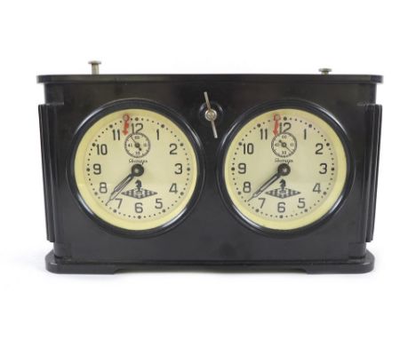 A Russian chess clock, in black Bakelite case, mid 20th century, signed 'Jantar' to cream coloured clock face in cyrillic, 27
