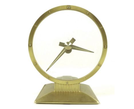 An Art Deco Jefferson 'Golden Hour' mystery clock, with brushed brass hands, base and bezel, applied brass and enamel hour ma
