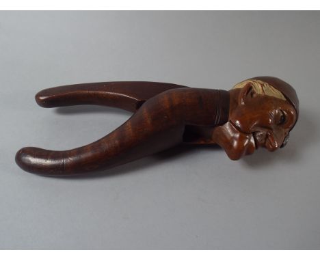 A Novelty Carved Black Forest Nutcracker in the Form of a Gentleman Wearing a Night Cap. In Very Good Condition.