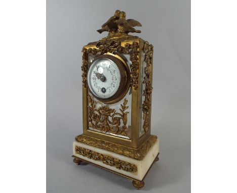A Pretty French Ormolu and Alabaster Mantel Clock with Love Birds Finial and Ribbon and Floral Swag Mouldings. 26cm High