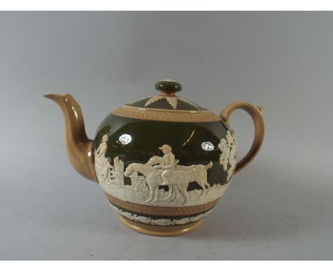 A Copeland Green and Cream Glazed Teapot with Hunting Scenes in Relief Impressed Marks 'England' and 'Copeland'