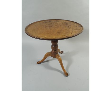 A Georgian Dish Top Table on Tripod Base Culminating in Paw Feet. 52.5cm High, 54cm Diameter