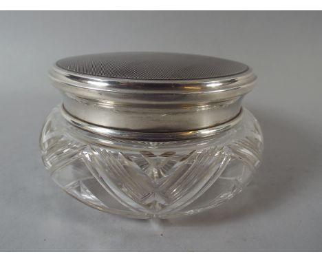 A Cut Glass Powder Bowl with Silver Plated Engine Turned Lid.