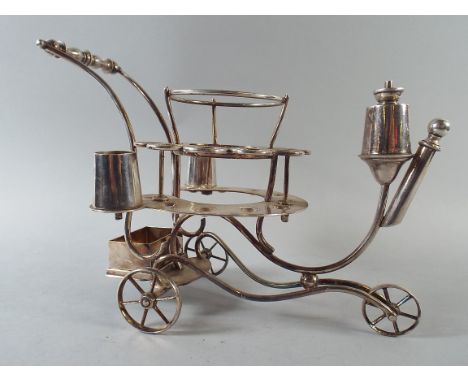 An Interesting Silver Plated Novelty Dinner Table Cigar Companion in the Form of a Three Wheeled Trolley with Cigar and Candl