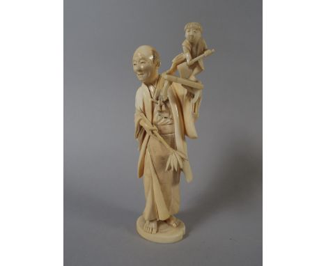 A 19th Century Ivory Okimono Depicting Woodcarver with Study of Boy with Axe. 14.5cm High