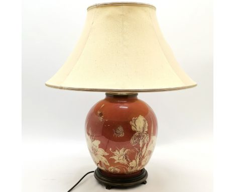 Contemporary floral decorated rust ground lamp complete with shade, lamp base, 44 cm high, good used condition. 