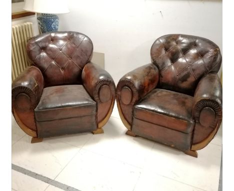 Pair of Art Deco leather club armchairs with button back detail, in worn condition, 90 cm wide, 85 cm deep, 86 cm high. 