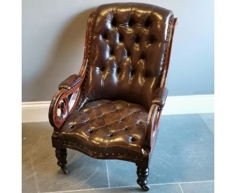 Antique mahogany framed leather upholstered button back library chair, with scroll arms in good condition, 67 cm wide, 80 cm 