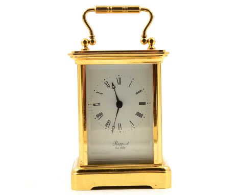 Rapport - a gilt metal carriage style timepiece clock, battery driven.