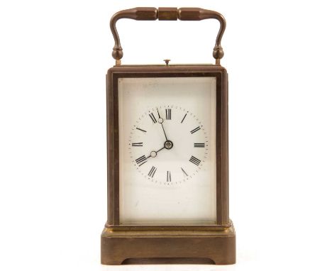 A repeating carriage clock, white enamel dial with Roman numeral chapter ring, bevelled glass panels to sides, large rectangu