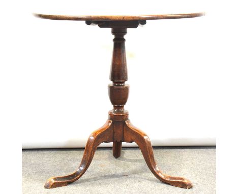 Old tripod table, mahogany circular tilt top, turned column and oak tripod legs, diameter 71cm, height 71cm.