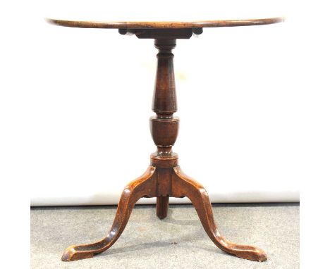 Old tripod table, mahogany circular tilt top, turned column and oak tripod legs, diameter 71cm, height 71cm.