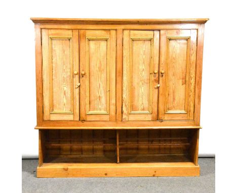 Pine housekeeper's cupboard, adapted, with four panelled doors under a moulded cornice, open shelf below, width 190cm, depth 