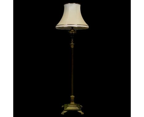 Brass Corinthian column standard lamp, stepped square base with paw feet, converted to electricity, 150cm to fitment, with sh