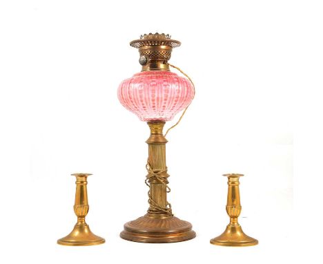 Victorian brass oil lamp, cranberry glass reservoir, converted to electricity, pair of cut-glass lustres (converted to electr