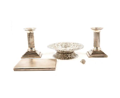 A pair of silver dwarf candlesticks, Robert Pringle &amp; Sons, Birmingham 1900, bead borders, square foot, weighted, 10cm; a