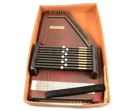 Auto-harp Zither, boxed.Condition report:It appears to be working. The plastic black cover that goes across the end of the st