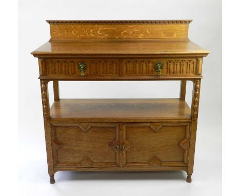A Marple and Co. light oak buffet, first half 20th Century, with channel moulded drawers above geometric moulded cupboard doo