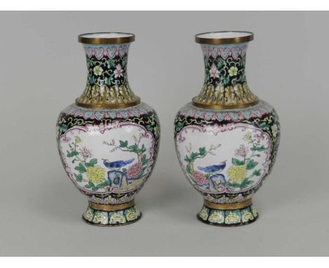 A pair of Chinese Canton enamel vases, Republic period, of baluster form and decorated with scenes of birds amid peonies and 