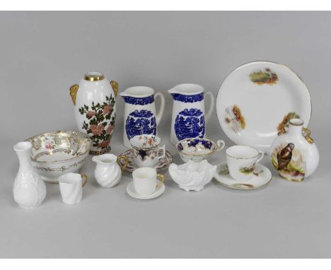 A collection of Coalport porcelain 19th century to include a landscape painted tea and coffee service, a twin-handled moon fl