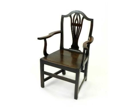 A 19th century oak open armchair, with vase splat and arched top rail, the plain panel seat raised on square section supports