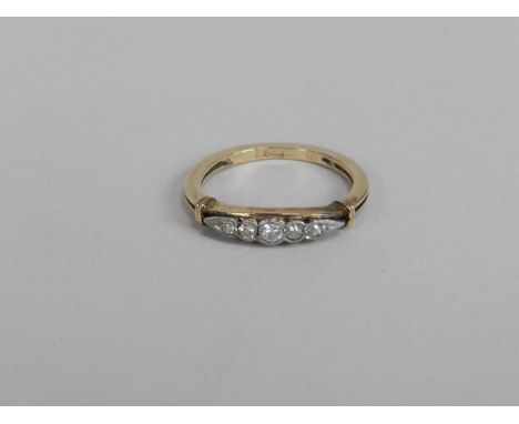 A graduated five stone diamond ring, the brilliant and transition cut diamonds claw set in white metal to yellow metal shank,