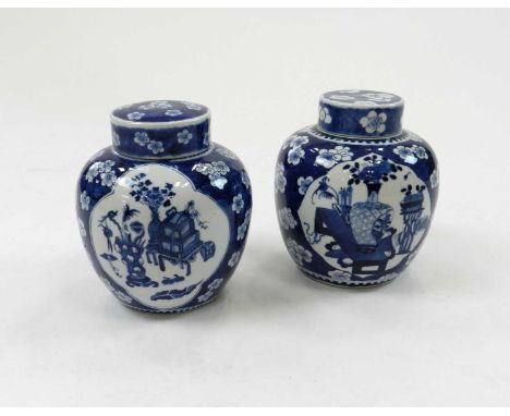 A pair of 19th century, Kangxi style, blue and white ginger jar and covers, 20cm high (4)