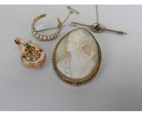 A late 19th/early 20th century split pearl crescent brooch, together with a yellow metal locket pendant in the form of a lyre